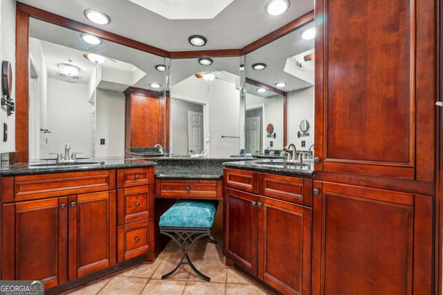 3777 Peachtree Rd NE Unit 911, Atlanta, GA 30319 - bathroom with lofted ceiling, vanity, and tile patterned floors