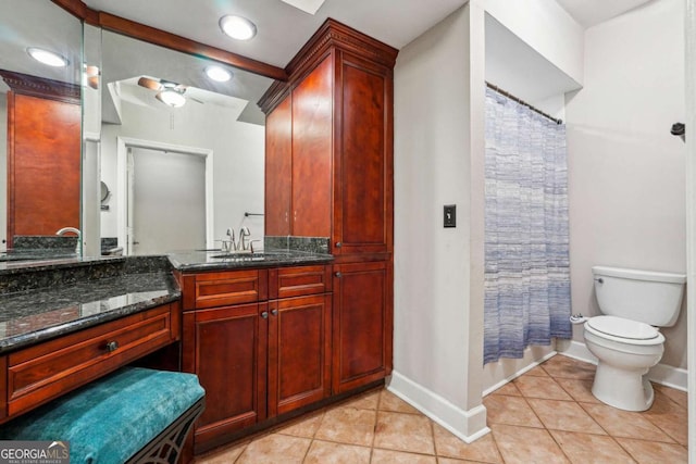 3777 Peachtree Rd NE Unit 911, Atlanta, GA 30319 - bathroom with tile patterned flooring, baseboards, vanity, and toilet