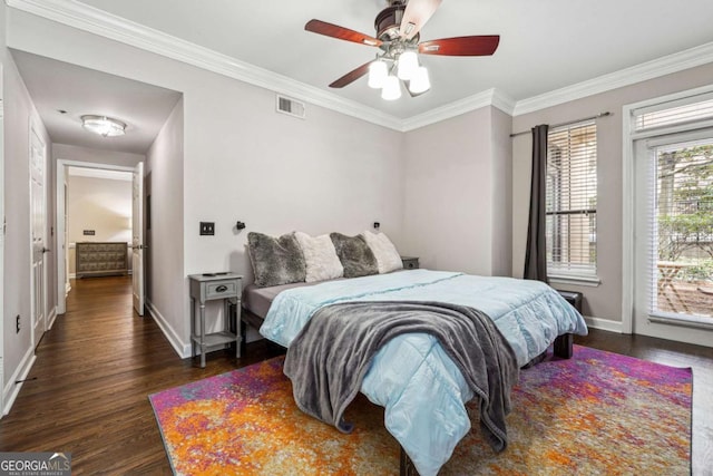 3777 Peachtree Rd NE Unit 911, Atlanta, GA 30319 - bedroom with crown molding, dark wood-style flooring, visible vents, and baseboards