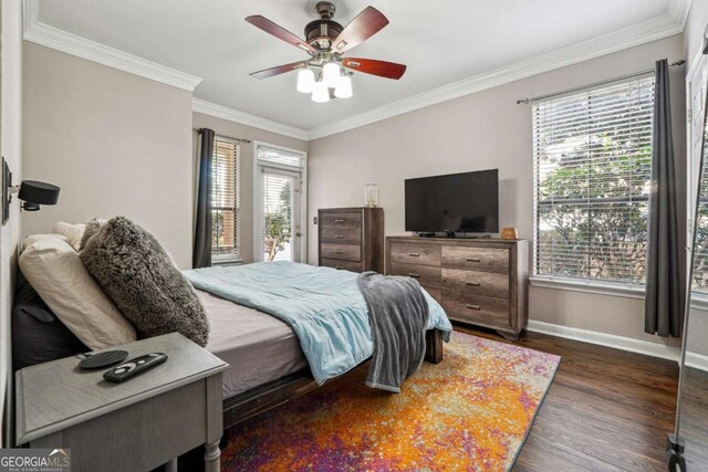 3777 Peachtree Rd NE Unit 911, Atlanta, GA 30319 - bedroom featuring dark wood-style floors, baseboards, a ceiling fan, and crown molding