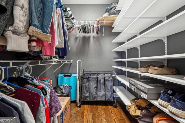 3777 Peachtree Rd NE Unit 911, Atlanta, GA 30319 - walk in closet with dark wood-style floors