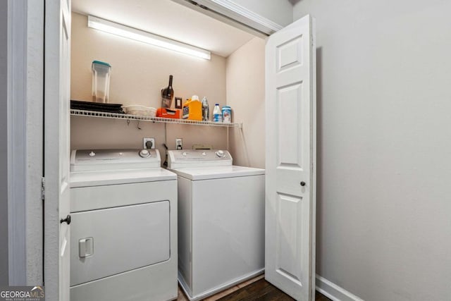 3777 Peachtree Rd NE Unit 911, Atlanta, GA 30319 - clothes washing area featuring laundry area, washing machine and dryer, dark wood finished floors, and baseboards