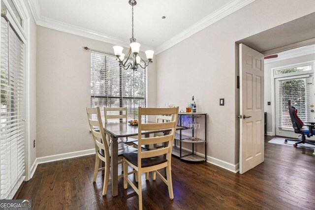 3777 Peachtree Rd NE Unit 911, Atlanta, GA 30319 - dining area featuring ornamental molding, dark wood-type flooring, an inviting chandelier, and baseboards