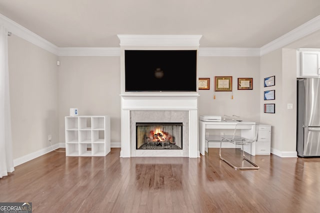 6441 SE Brookside Blvd, Mableton, GA 30126 - unfurnished living room featuring ornamental molding, a high end fireplace, baseboards, and wood finished floors