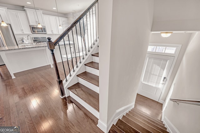 6441 SE Brookside Blvd, Mableton, GA 30126 - stairway featuring recessed lighting, baseboards, and wood finished floors