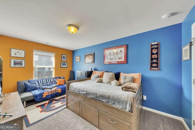 carpeted bedroom featuring visible vents and baseboards