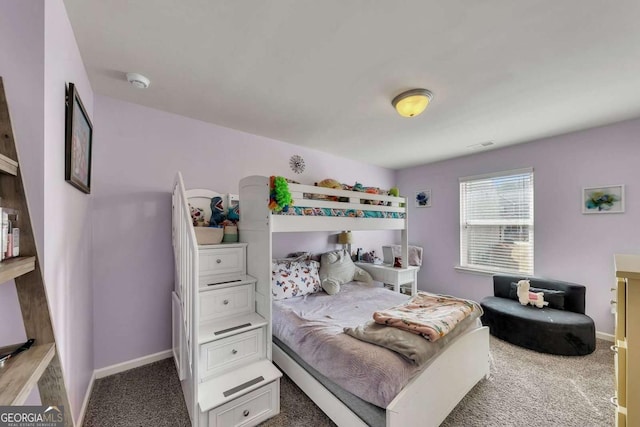 bedroom with dark carpet, visible vents, and baseboards