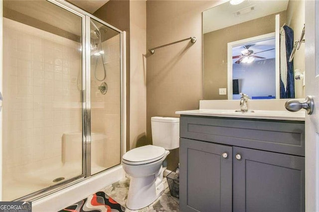 bathroom featuring a stall shower, visible vents, vanity, and toilet