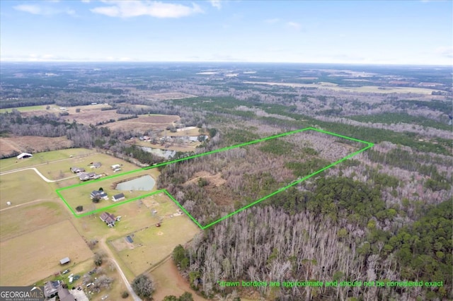 birds eye view of property with a rural view