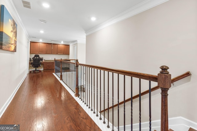 corridor with baseboards, crown molding, visible vents, and dark wood-type flooring