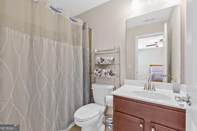 bathroom featuring ceiling fan, toilet, vanity, visible vents, and ensuite bath