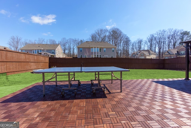 view of patio / terrace featuring a residential view, a fenced backyard, and outdoor dining space