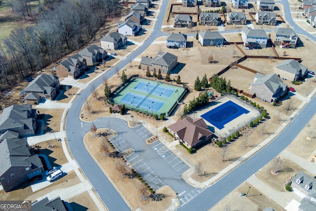 birds eye view of property with a residential view