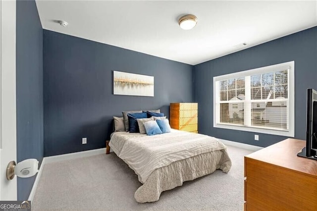 bedroom featuring carpet flooring and baseboards