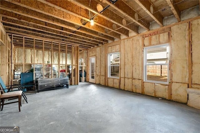 miscellaneous room featuring unfinished concrete flooring