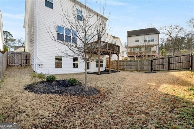 back of property with a fenced backyard