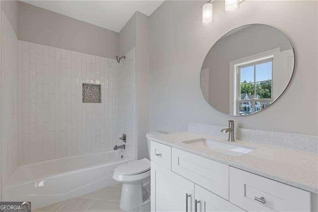 bathroom with toilet, tile patterned floors, vanity, and shower / bathtub combination