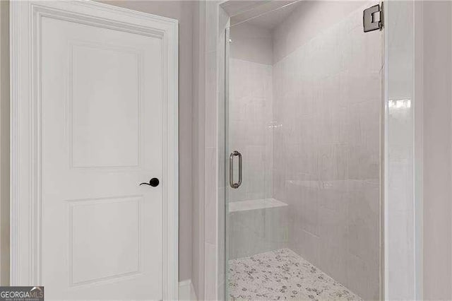 bathroom featuring a stall shower