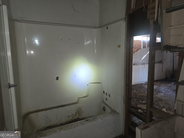 bathroom featuring a tub to relax in