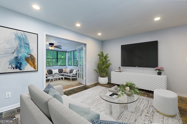 living room with recessed lighting and baseboards