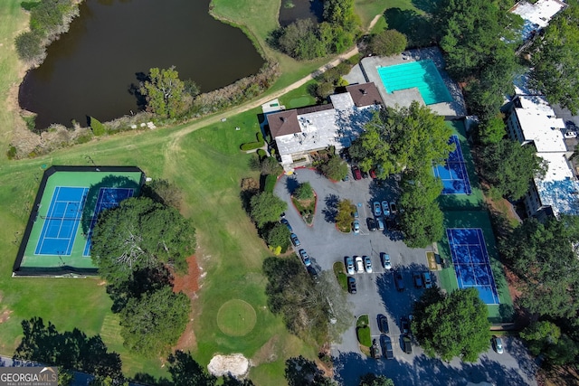 birds eye view of property with a water view