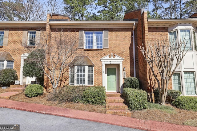 view of front of house featuring brick siding