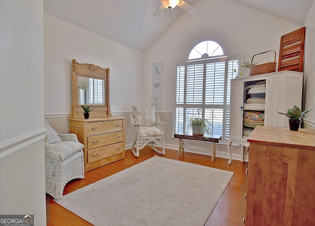 sitting room featuring lofted ceiling, ceiling fan, and wood finished floors