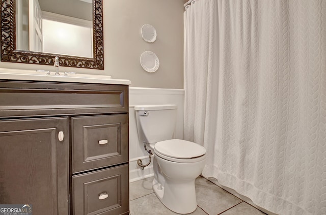 full bath featuring vanity, toilet, and tile patterned floors