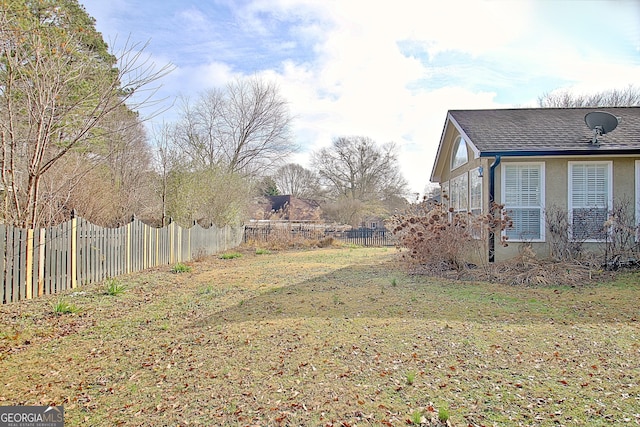 view of yard with a fenced backyard