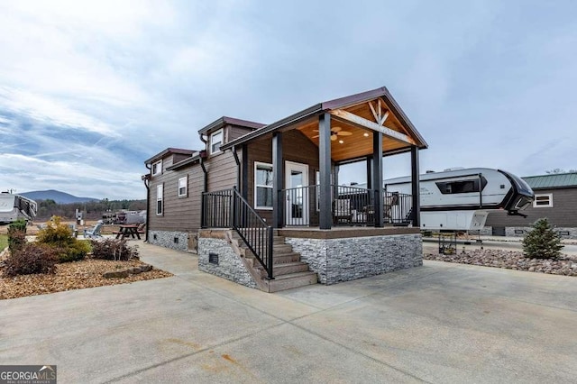 view of front of property with a mountain view