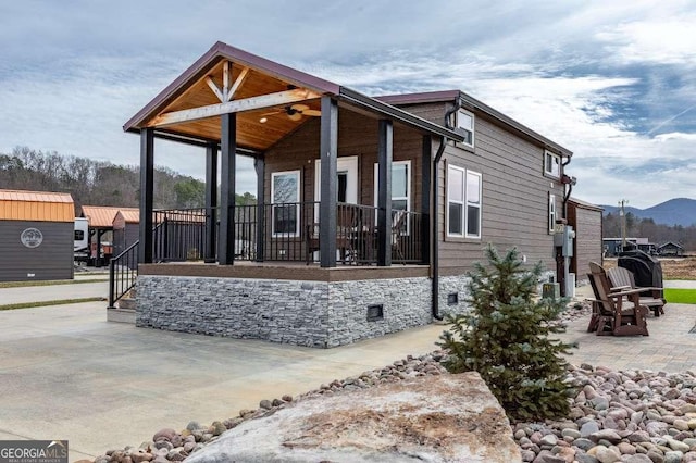 exterior space featuring a patio area and a mountain view