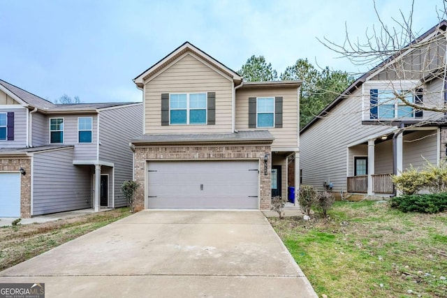 view of front of property featuring driveway, a garage, and brick siding