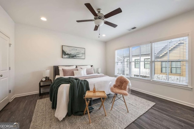 bedroom with recessed lighting, visible vents, baseboards, and dark wood finished floors