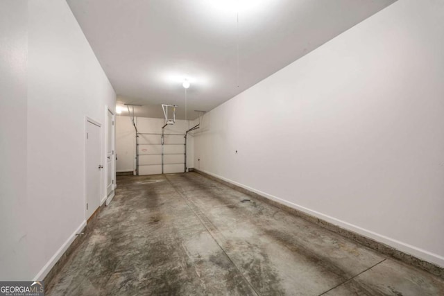 garage featuring baseboards