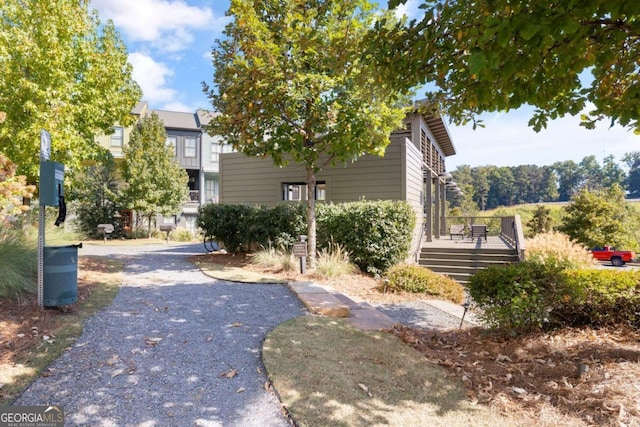 surrounding community featuring a deck