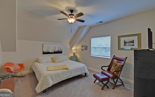 bedroom with visible vents, baseboards, a ceiling fan, lofted ceiling, and carpet