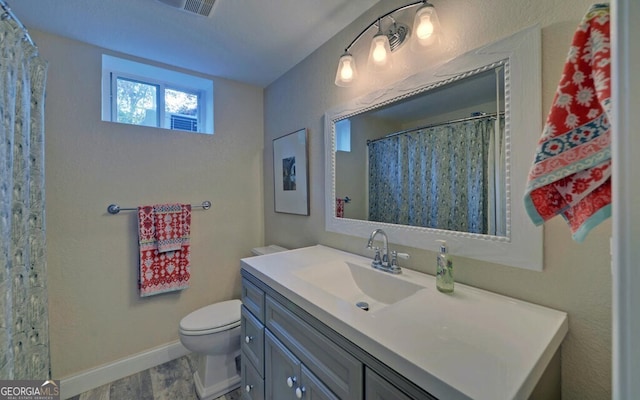 full bath featuring baseboards, vanity, toilet, and wood finished floors