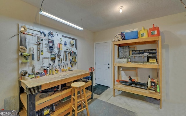 dining area featuring concrete floors and a workshop area