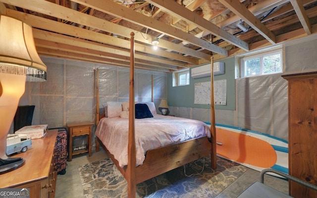 bedroom with concrete flooring and a wall unit AC