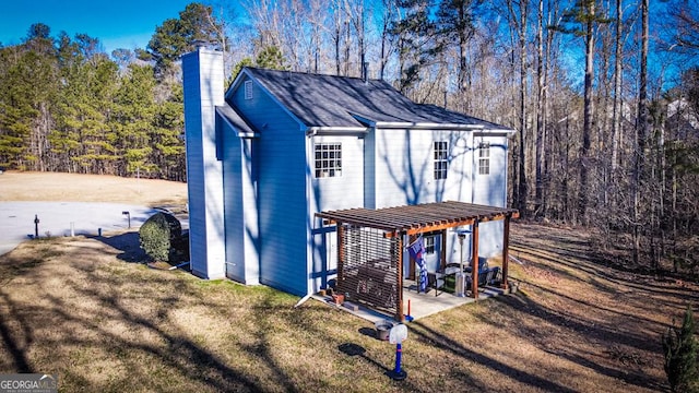 view of outbuilding with a pergola