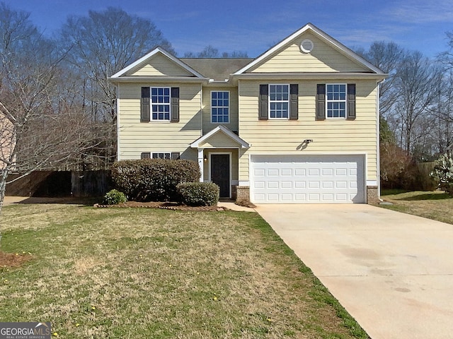 traditional-style home featuring a garage, a front yard, brick siding, and driveway