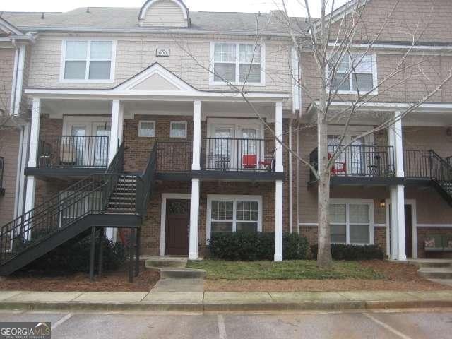 1035 Barnett Shoals Rd Unit 610, Athens, GA 30605 - view of front of property featuring stairway and brick siding
