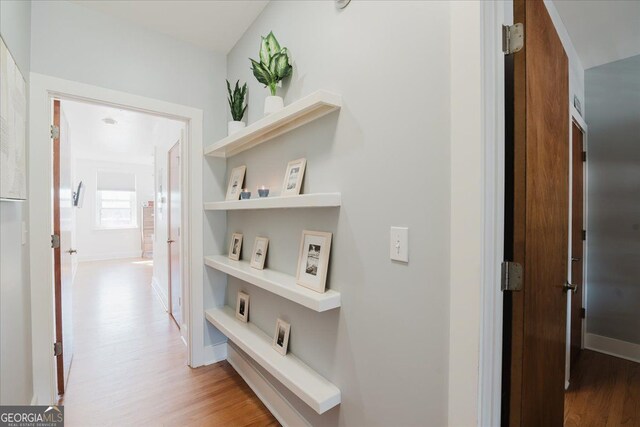 1253 Caroline St NE Unit 223, Atlanta, GA 30307 - hallway featuring light wood finished floors and baseboards