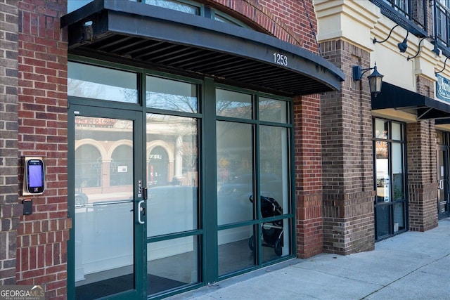 1253 Caroline St NE Unit 223, Atlanta, GA 30307 - doorway to property featuring brick siding