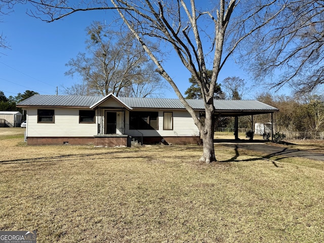 ranch-style home featuring metal roof, a carport, crawl space, and a front yard