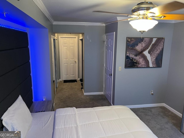 unfurnished bedroom with carpet floors, baseboards, and ornamental molding