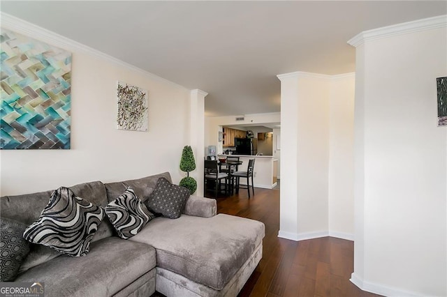 living room with crown molding, dark wood finished floors, and baseboards