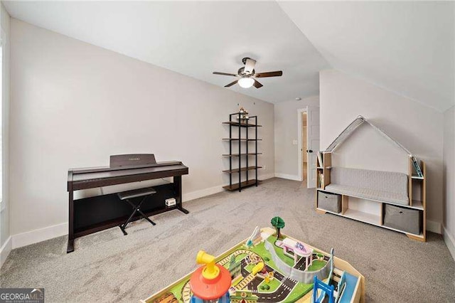 rec room with carpet, a ceiling fan, and baseboards