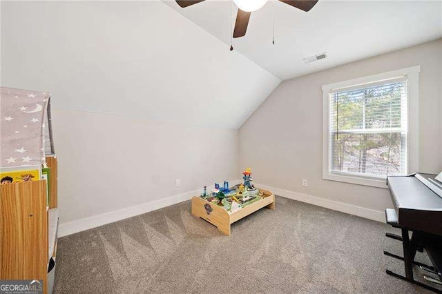 rec room featuring lofted ceiling, carpet, visible vents, and baseboards