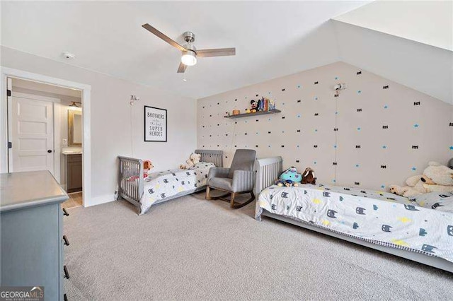 bedroom with lofted ceiling, ceiling fan, and light colored carpet